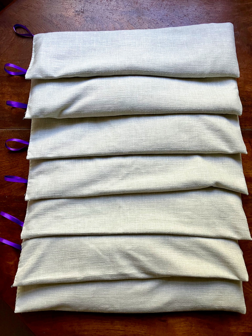 Set of 8 Natural Lavender scented Linen Wheat Bags with purple ribbon hooks by Curlew Crafts