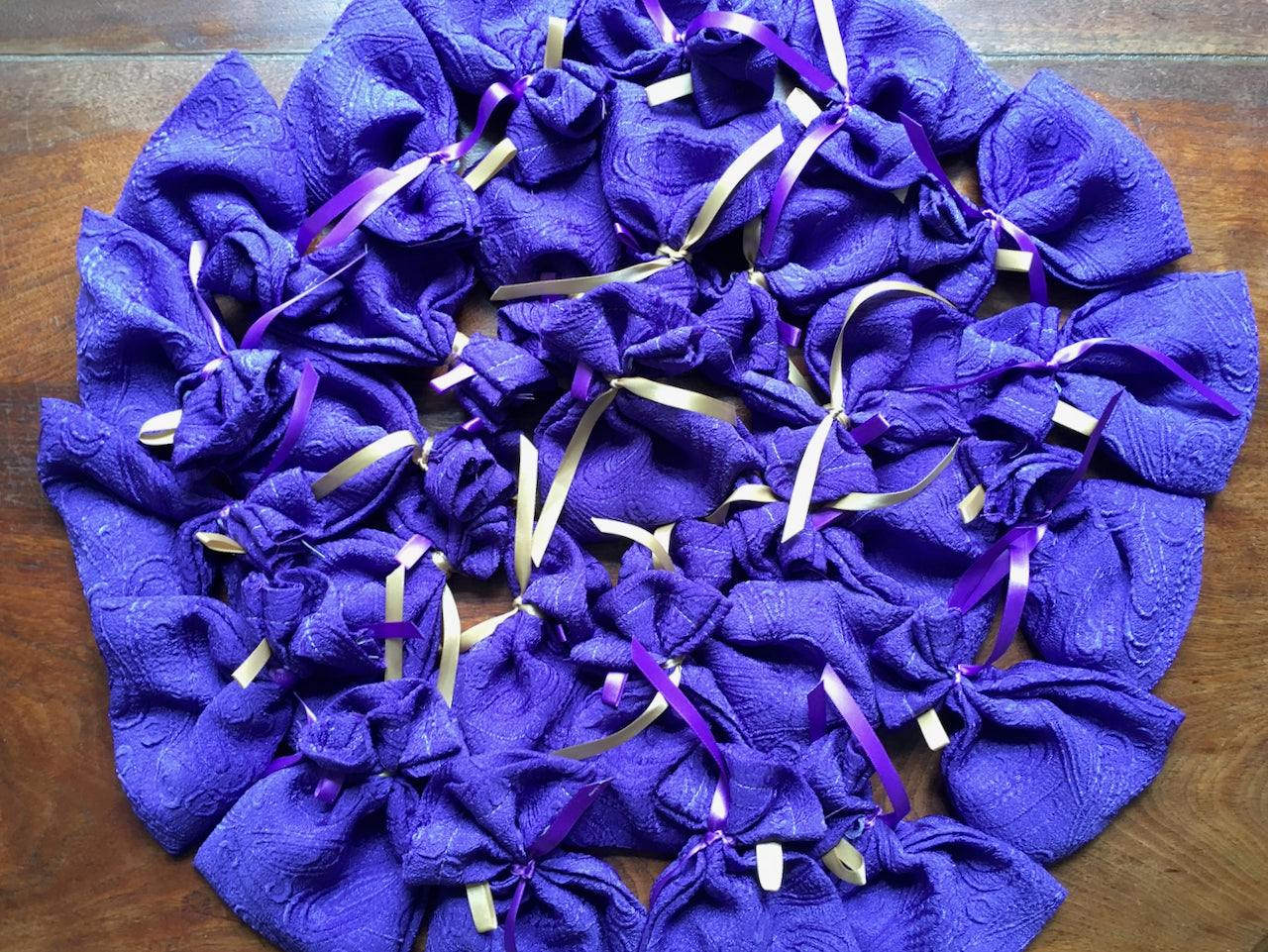 Circular arrangement of purple Lavender bags with ribbons by Curlew Crafts