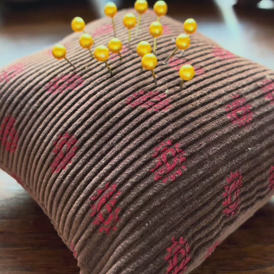 A single Chestnut and Rose Paisley Pincushion by Curlew Crafts, with pins